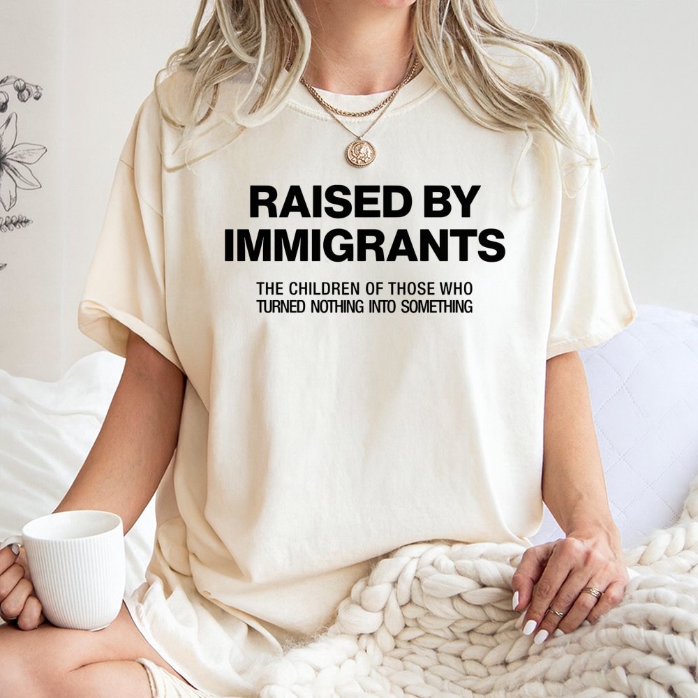 Raised By Immigrants T-Shirt | First Generation Pride Graphic Tee | Premium 100% Cotton Apparel | Meaningful Gift For Heritag