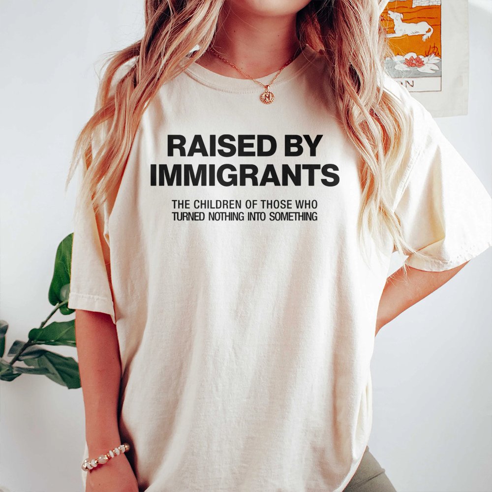 Raised By Immigrants T-Shirt | First Generation Pride Graphic Tee | Premium 100% Cotton Apparel | Meaningful Gift For Heritag