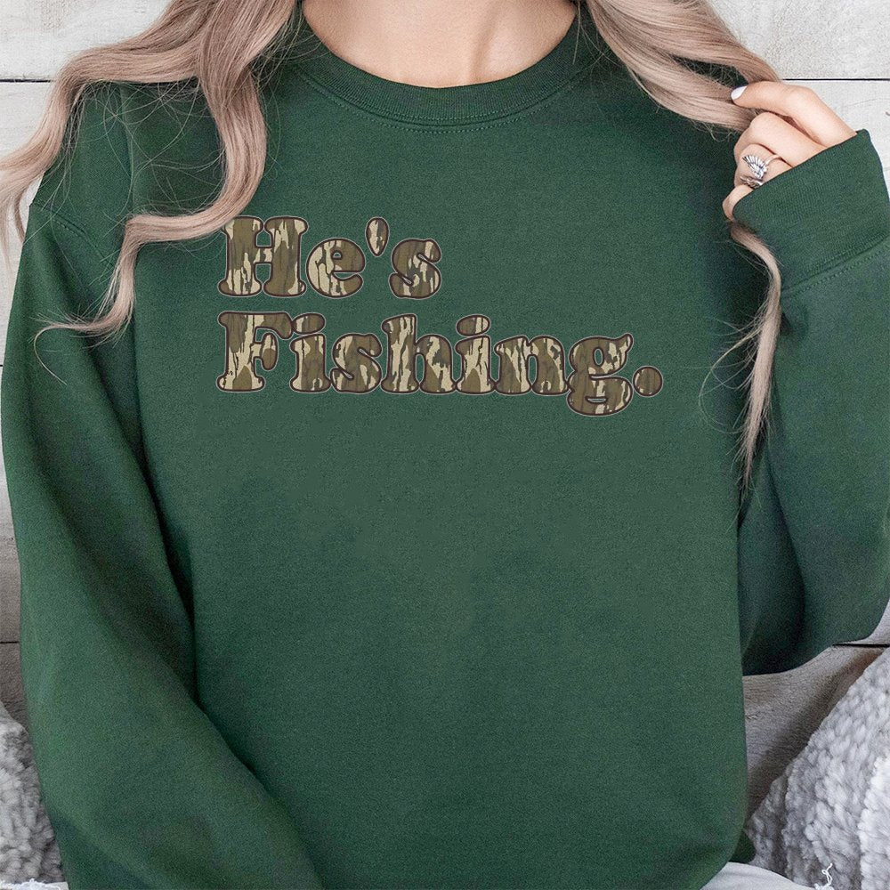 He's Fishing Sweatshirt | Camo Lettering Graphic Print | Soft Cotton-Blend Premium Apparel | Gift for Angler Fisherman Outdoo