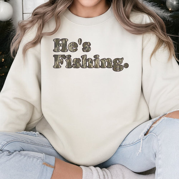 He's Fishing Sweatshirt | Camo Lettering Graphic Print | Soft Cotton-Blend Premium Apparel | Gift for Angler Fisherman Outdoo