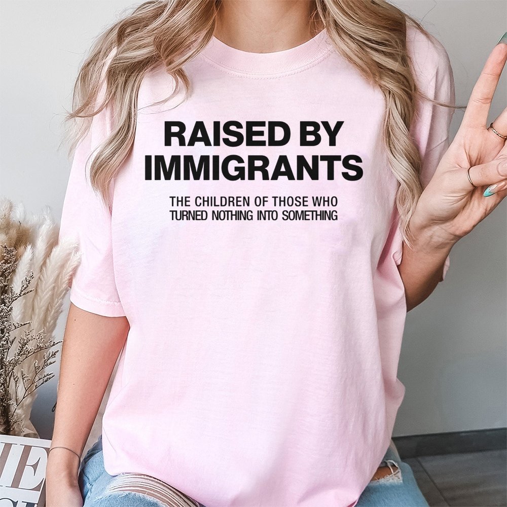 Raised By Immigrants T-Shirt | First Generation Pride Graphic Tee | Premium 100% Cotton Apparel | Meaningful Gift For Heritag
