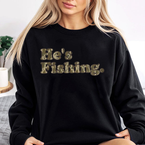 He's Fishing Sweatshirt | Camo Lettering Graphic Print | Soft Cotton-Blend Premium Apparel | Gift for Angler Fisherman Outdoo