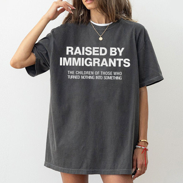 Raised By Immigrants T-Shirt | First Generation Pride Graphic Tee | Premium 100% Cotton Apparel | Meaningful Gift For Heritag