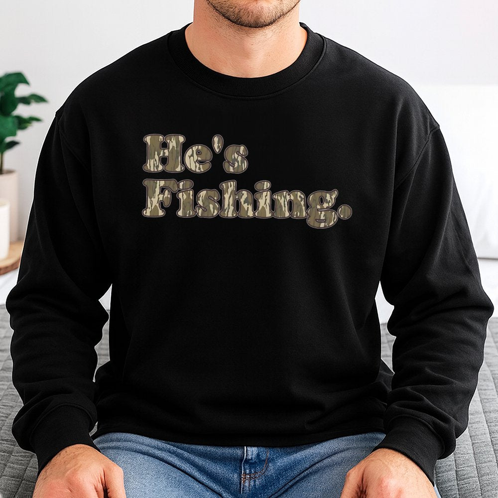 He's Fishing Sweatshirt | Camo Lettering Graphic Print | Soft Cotton-Blend Premium Apparel | Gift for Angler Fisherman Outdoo